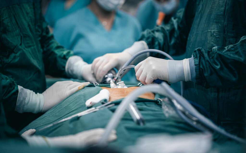 A detailed view of surgeons in action during an operation, highlighting surgical precision.